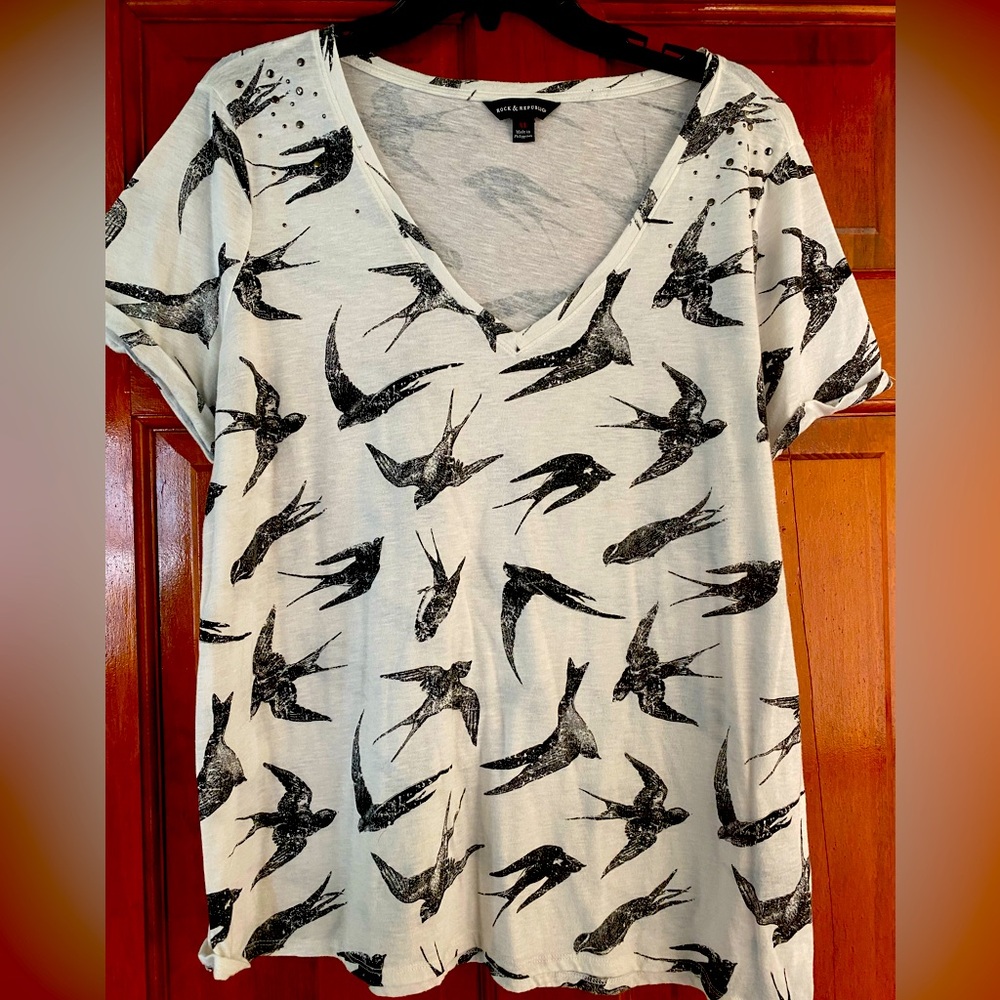 Graphic tee with sparrows and studs.